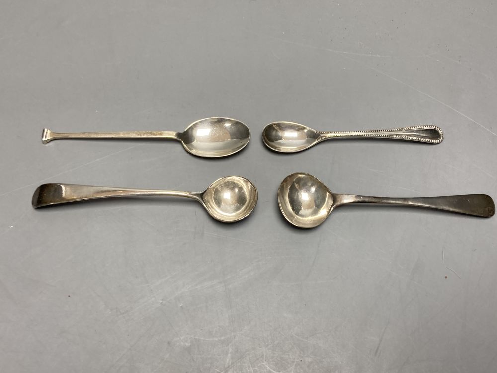 A pair of Georgian silver circular salts, a George III urn-shaped pepper pot and 4 various spoons.